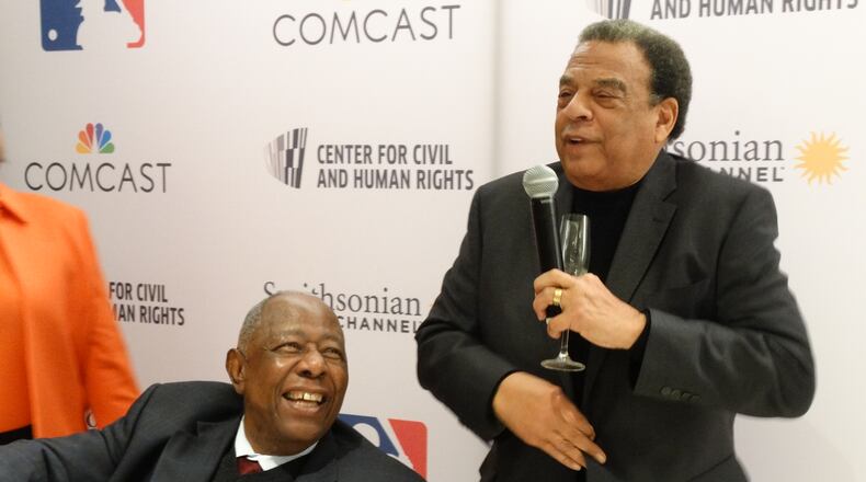 Hank Aaron (left) gets feted by Ambassador Andrew Young Feb. 5, 2016 before a screening of the Smithsonian documentary. It was Aaron's 82nd birthday. CREDIT: Rodney Ho/ rho@ajc.com