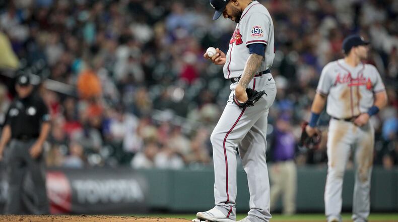 Atlanta Braves starting pitcher Huascar Ynoa (19) holds the ball and waits for to be taken out of a game against the Colorado Rockies in the sixth inning of a baseball game in Denver, Friday, Sept. 3, 2021. (AP Photo/Joe Mahoney)