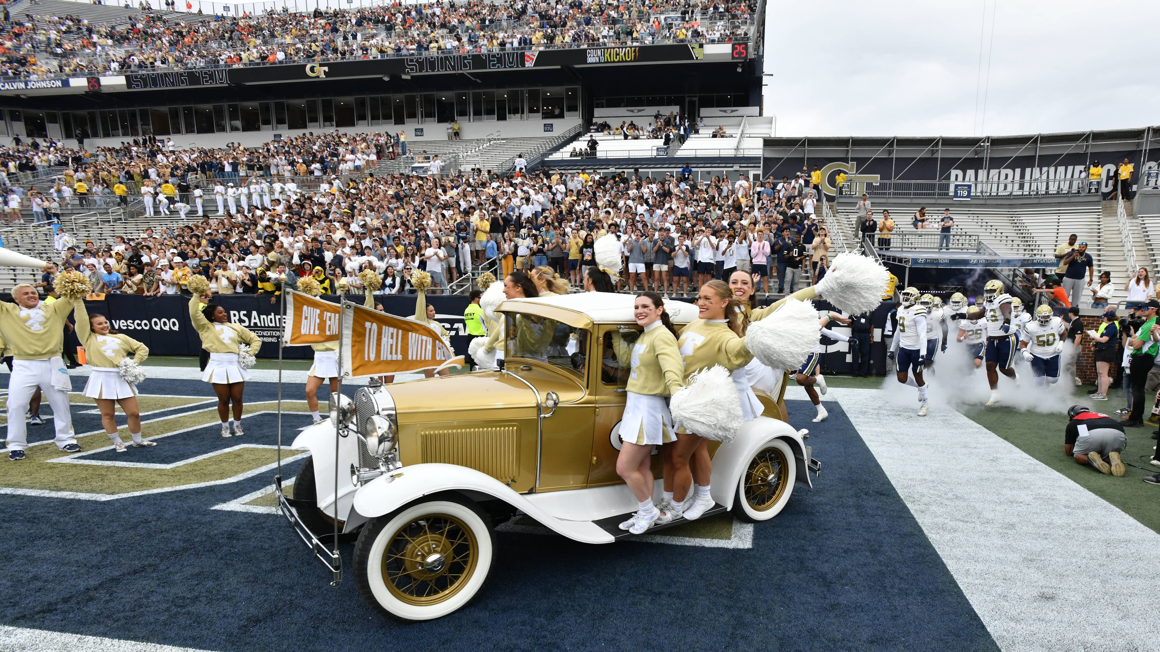 Georgia Tech's Ramblin' Wreck — pictured leading the band, cheerleaders, players and coaches onto the field before a November game against Miami — was sidelined for the game Saturday, Sept. 6, 2025, due to a condensed pregame schedule caused by a lightning delay. (Hyosub Shin / AJC 2024)