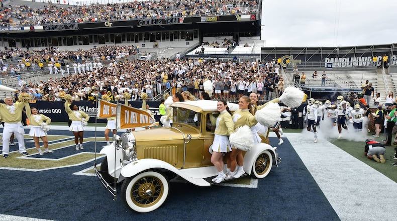 Georgia Tech's Ramblin' Wreck leads the band, cheerleaders, Buzz, players, and coaches before an NCAA college football game against Miami at Georgia Tech's Bobby Dodd Stadium, Saturday, November 9, 2024, in Atlanta. (Hyosub Shin / AJC)