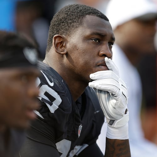 FILE - Oakland Raiders linebacker Aldon Smith (99) sits on the bench during the second half of the team's NFL football game against the Cincinnati Bengals in Oakland, Calif., on Sept. 13, 2015. (AP Photo/Ben Margot, File)