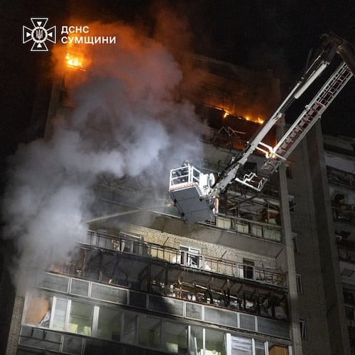 In this photo provided by the Ukrainian Emergency Services on Saturday, April 4, 2026, rescue workers put out a fire of a residential building damaged following a Russian strike in Sumy, Ukraine. (Ukrainian Emergency Service via AP)