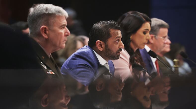 From left, Acting Commander of the U.S. Cyber Command William Hartman, FBI Director Kash Patel, Director of National Intelligence Tulsi Gabbard and CIA Director John Ratcliffe, listen during a House Permanent Select Committee on Intelligence hearing to examine worldwide threats, Thursday, March 19, 2026, on Capitol Hill in Washington. (AP Photo/Tom Brenner)