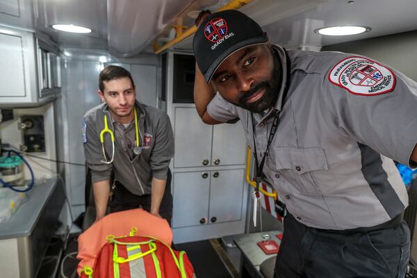 May 19, 2020 Atlanta: Grady EMS advanced EMT, Cole Bruton (left) and paramedic, Jeffery Forrest (right). Advanced EMT Cole Burton commenting on his service during the pandemic said, "It's been pretty good. Proper social distancing helps." Paramedic, Jeffery Forrest said, "It's very unfortunate we globally have to go through this. I would just advise everybody use universal precautions and wash your hands and keep your mask on until we can get this under control." JOHN SPINK/JSPINK@AJC.COM.