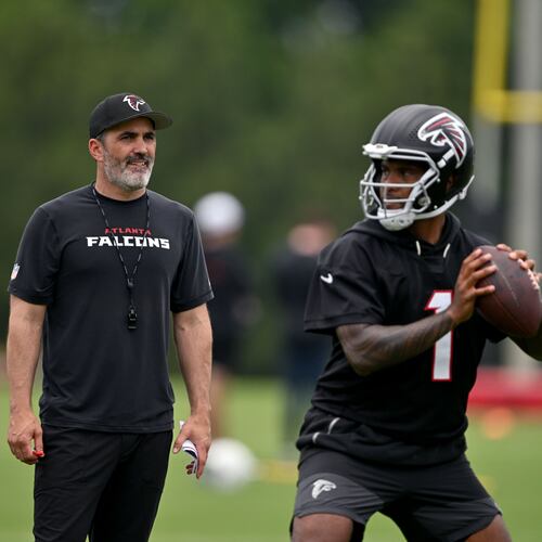 Atlanta Falcons coach Kevin Stefanski watches as Atlanta Falcons quarterback Tua Tagovailoa runs a drill during an OTA workout at Atlanta Falcons Training Facility on Wednesday, May 27, 2026, in Flowery Branch. (Hyosub Shin/AJC)