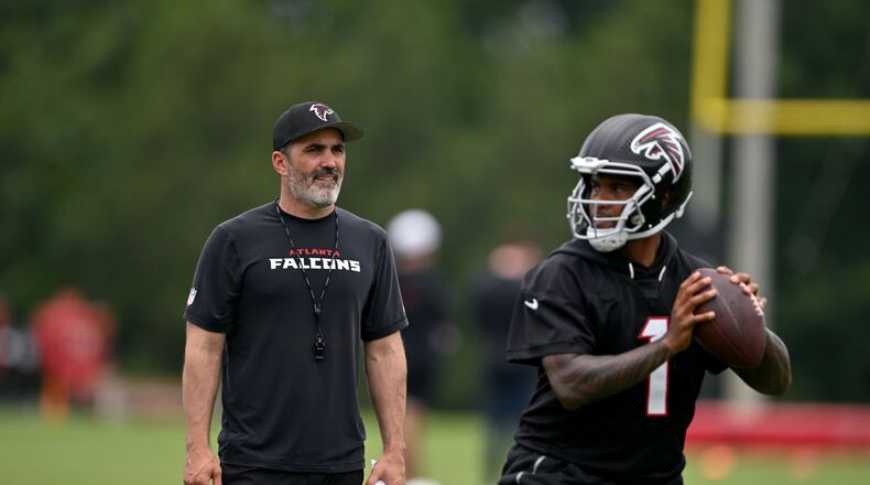 Atlanta Falcons coach Kevin Stefanski watches as Atlanta Falcons quarterback Tua Tagovailoa runs a drill during an OTA workout at Atlanta Falcons Training Facility on Wednesday, May 27, 2026, in Flowery Branch. (Hyosub Shin/AJC)