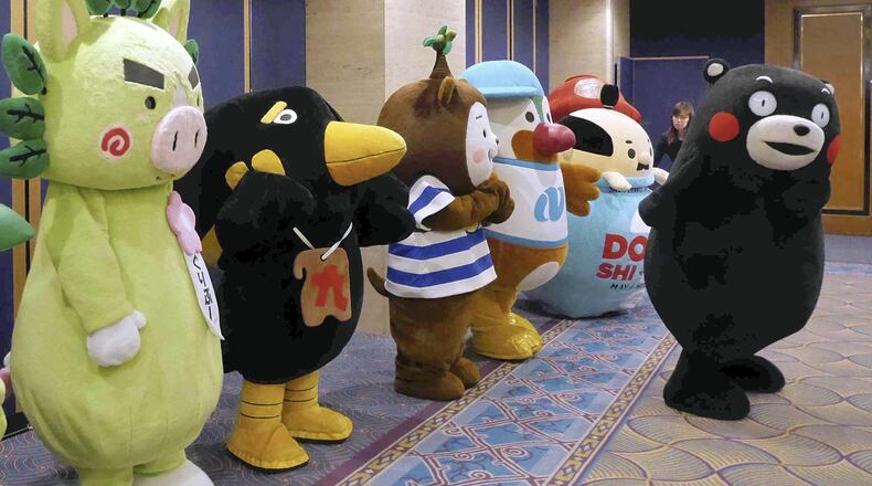 Mascots from Kyushu gather at an ANA Holdings event in Tokyo to promote tourism to the region on Tuesday. PHOTO: The Japan News/Yomiuri