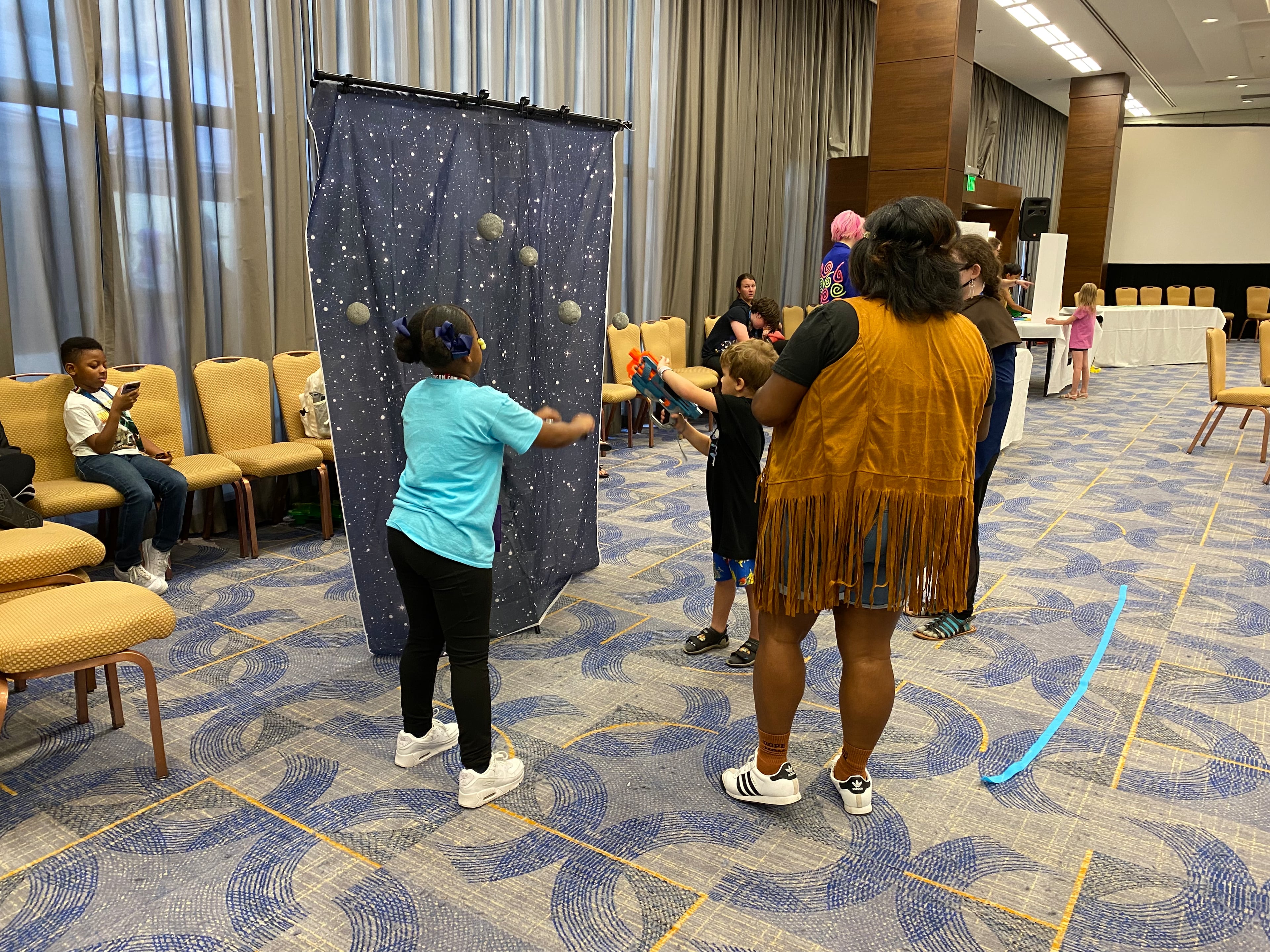Children participate in a hands-on, space-themed activity as part of the Kids Track at Dragon Con. (Courtesy of Jonathan McFarland).