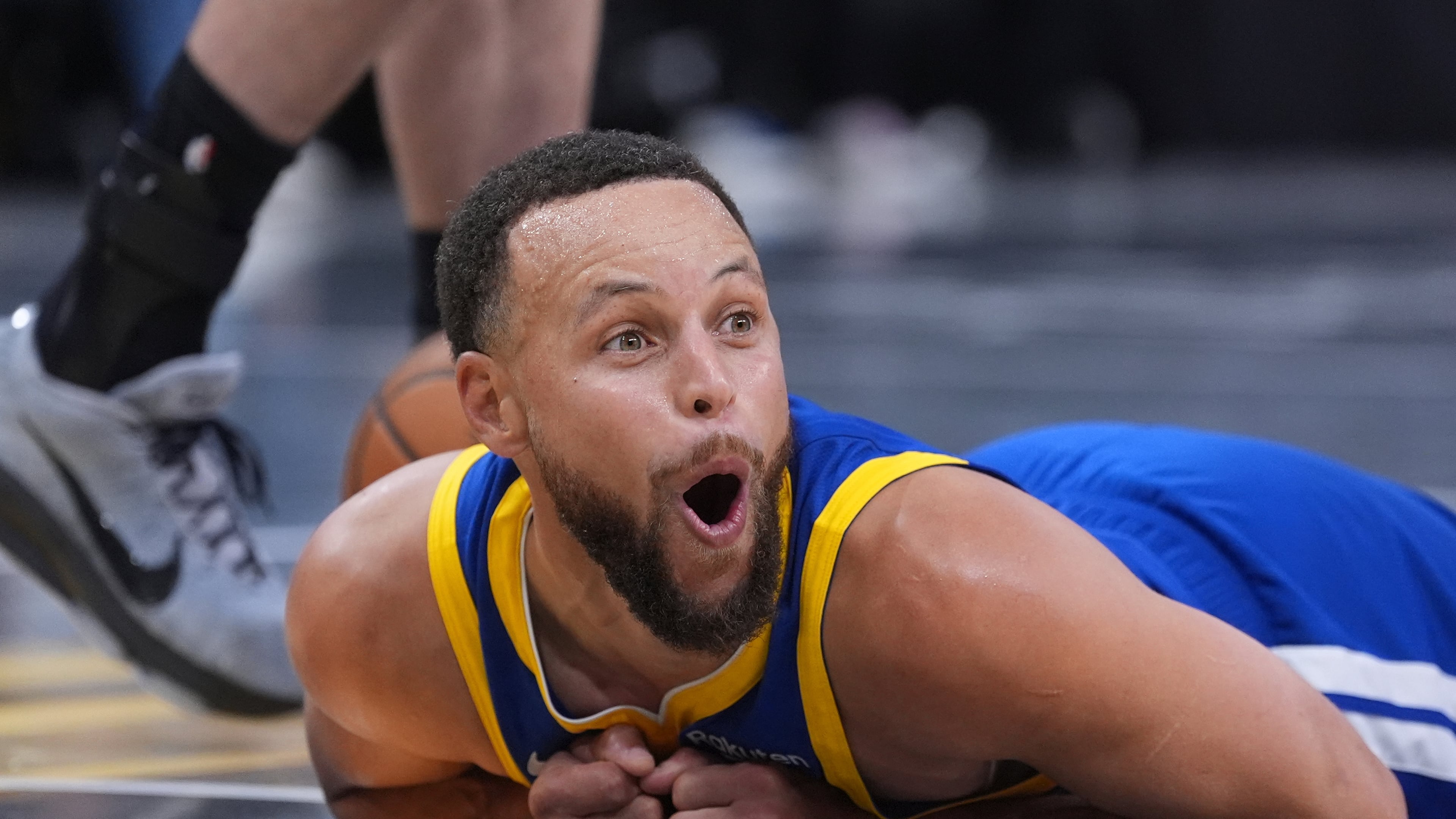 Golden State Warriors guard Stephen Curry (30) reacts after he was fouled during the second half of an NBA Cup basketball game against the San Antonio Spurs in San Antonio, Friday, Nov. 14, 2025. (AP Photo/Eric Gay)