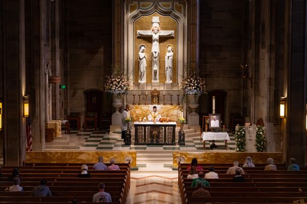 Pope Francis' portrait sits on a table next to  the altar during morning Mass at Cathedral of Christ the King Catholic Church in Atlanta, Monday, April 21, 2025 (Ben Hendren for The Atlanta Journal-Constitution)