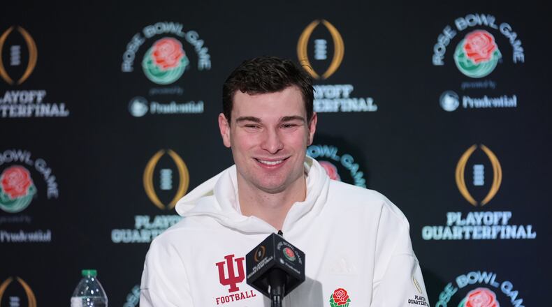 Indiana quarterback Fernando Mendoza (15) answers questions during a press conference ahead of Thursday's Rose Bowl College Football Playoff against Alabama Tuesday, Dec. 30, 2025, in Los Angeles. (AP Photo/Marcio Jose Sanchez)