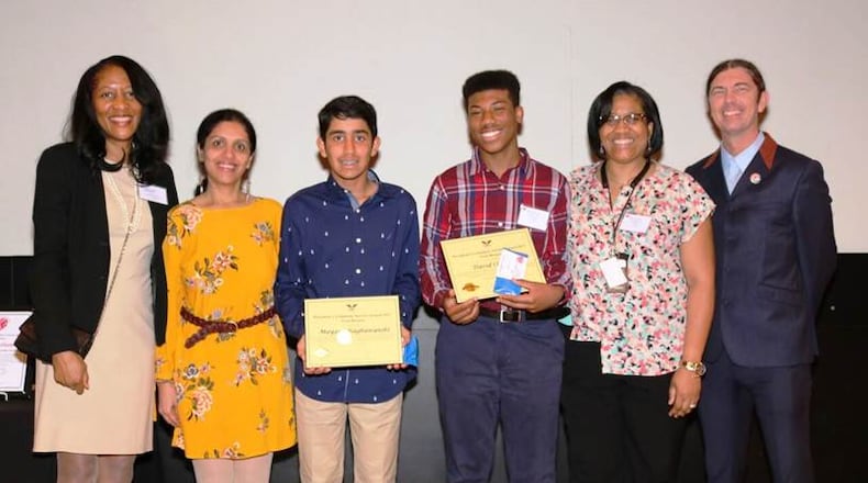 Commissioner Natalie Hall, Deepali Raghuwanshi, teen bronze award winners Mayank Raghuwanshi and David Clemons, Kysh Clemons and Dr. Gabriel Morley celebrate the teens’ service to the library. The Library System awards teens and young adults with the National President’s Volunteer Service Awards for serving over 50 hours annually. CONTRIBUTED