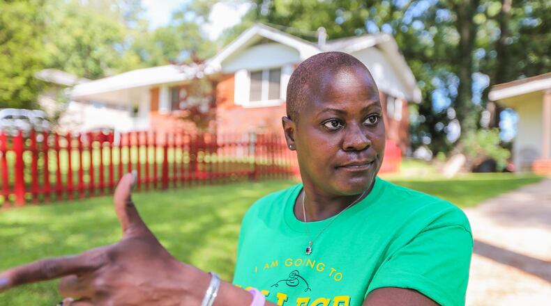 Tama Colson lives two doors down from Chris and Leah McKinley, the owners of the home where the shooting occurred. JOHN SPINK / JSPINK@AJC.COM