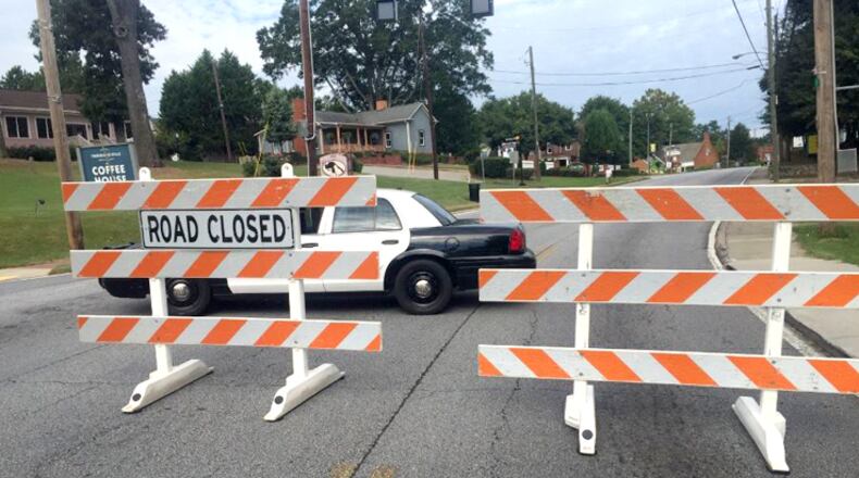 A section of Woodstock Road near Woodstock will be closed for two weeks starting Tuesday. AJC FILE