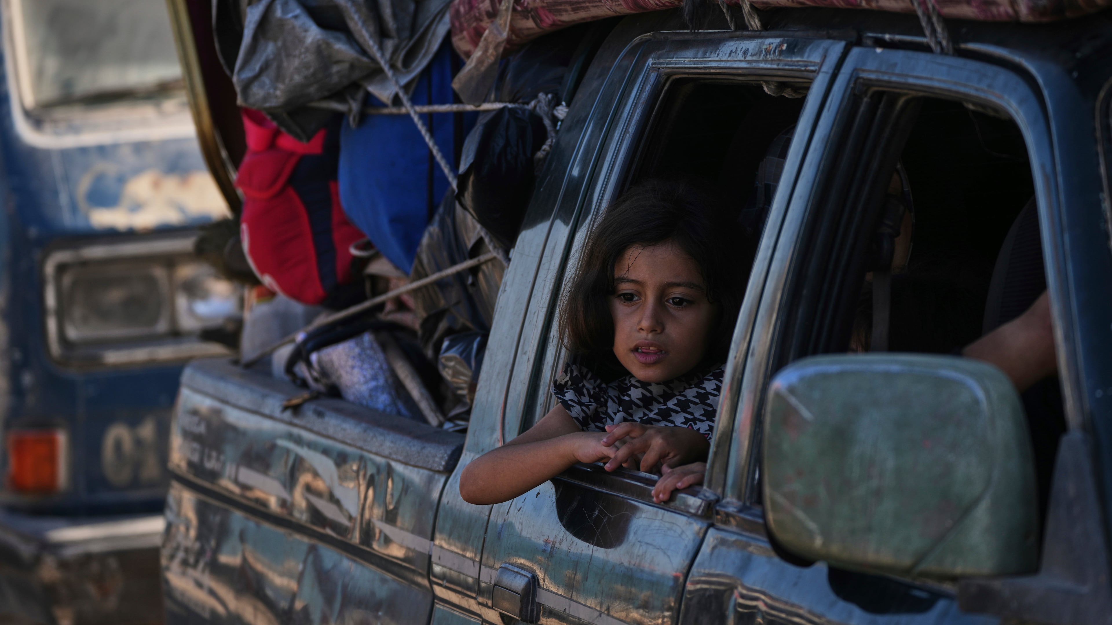 Displaced Palestinians flee northern Gaza along the coastal road toward the south, after Israel's military says its expanded operation in Gaza City has begun and warns residents to leave, Tuesday, Sept. 16, 2025. (AP Photo/Abdel Kareem Hana)