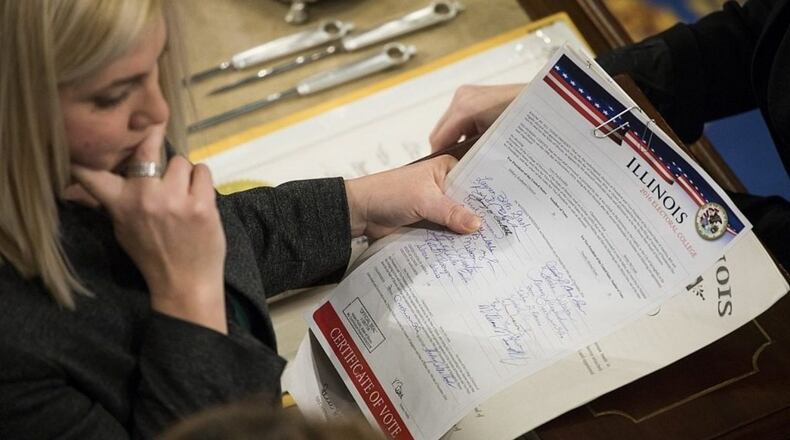 WASHINGTON, D.C.- JANUARY 6: House Clerk staff verifies the official Electoral College votes from the State of Illinois during a joint session of Congress at the U.S. Capitol in Washington, D.C.