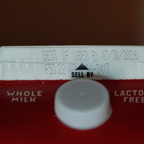 A Best If Used By date is stamped above a Sell By label on a milk carton, Tuesday, June 30, 2026, in San Francisco. (AP Photo/Jeff Chiu)