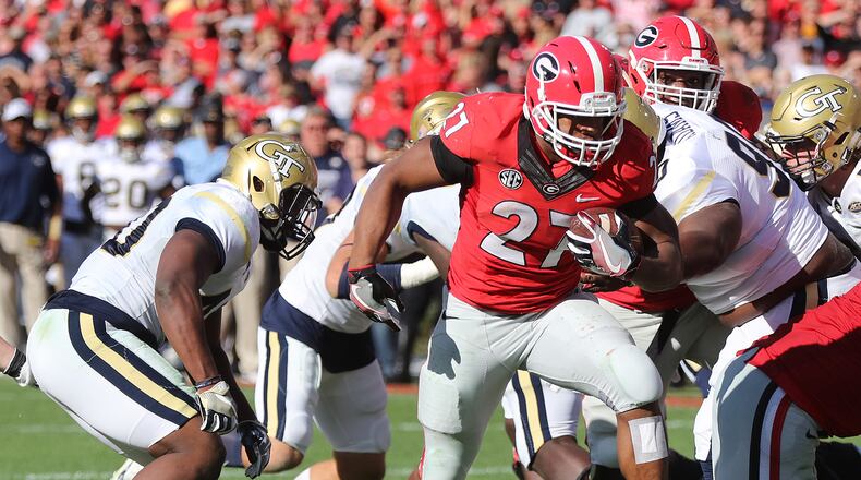 November 26, 2016, Athens: Georgia tailback Nick Chubb breaks free for a touchdown and a 24-14 lead over Georgia Tech during the third quarter in a NCAA college football rivalry game on Saturday, Nov. 26, 2016, in Athens. Curtis Compton/ccompton@ajc.com