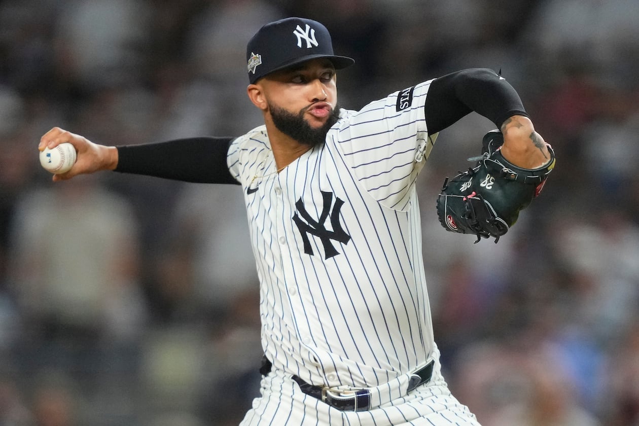 FILE - New York Yankees pitcher Devin Williams delivers against the Toronto Blue Jays during the seventh inning of Game 3 of baseball's American League Division Series, Oct. 7, 2025, in New York. (AP Photo/Yuki Iwamura, File)