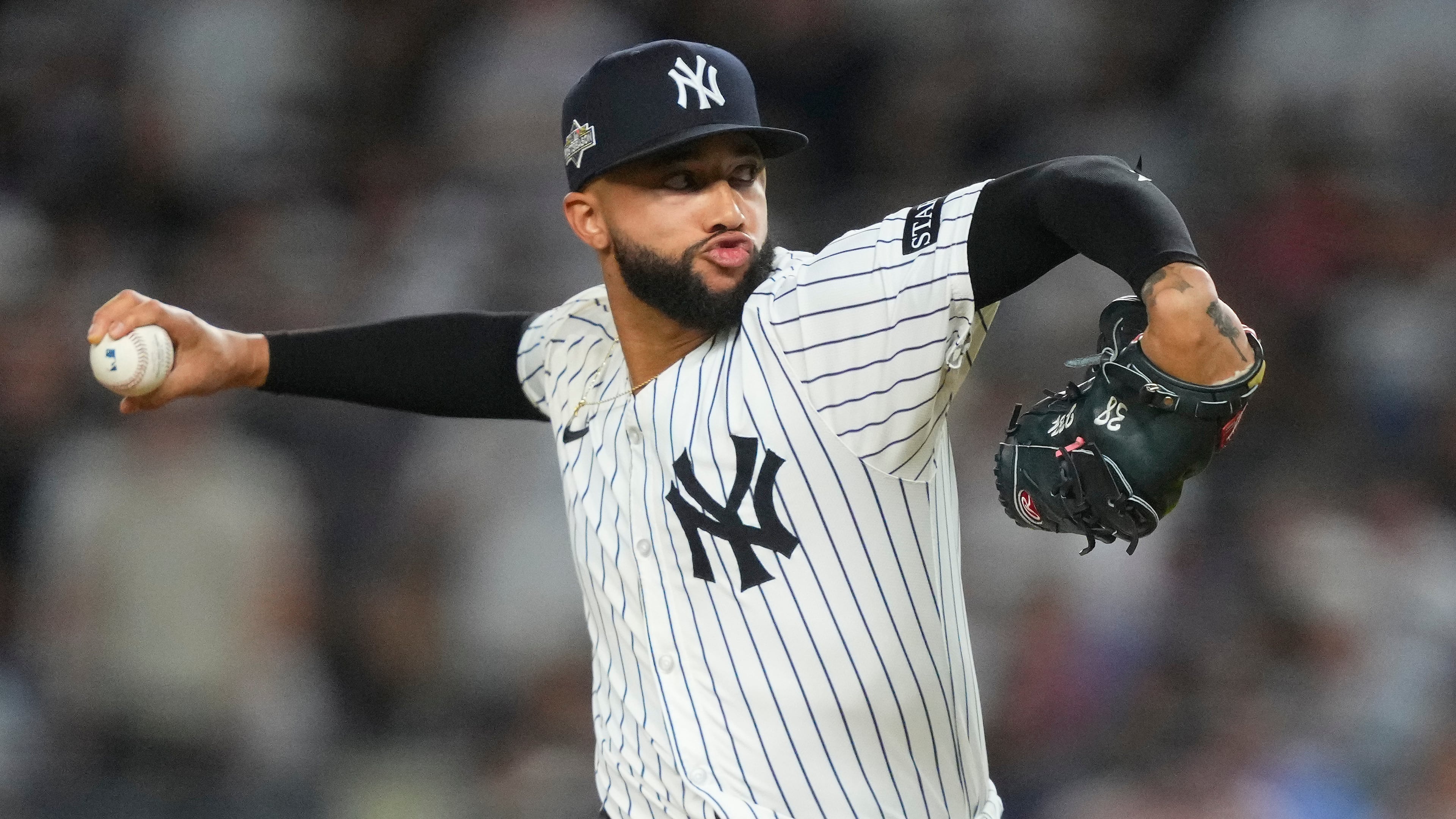 FILE - New York Yankees pitcher Devin Williams delivers against the Toronto Blue Jays during the seventh inning of Game 3 of baseball's American League Division Series, Oct. 7, 2025, in New York. (AP Photo/Yuki Iwamura, File)