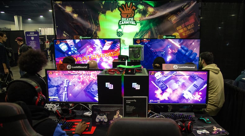 DreamHack attendees play Death Carnival, an arcade multiplayer shooter game, at the Georgia World Congress Center in 2019. (Steve Schaefer /AJC File 2020)