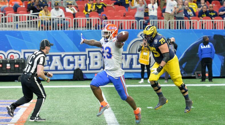 Florida defensive back Chauncey Gardner-Johnson (23) celebrates as he scores a touchdown after he picked up a fumble in the second half of the Chick-fil-A Peach Bowl at Mercedes-Benz Stadium on Saturday, December 29, 2018.  HYOSUB SHIN / HSHIN@AJC.COM