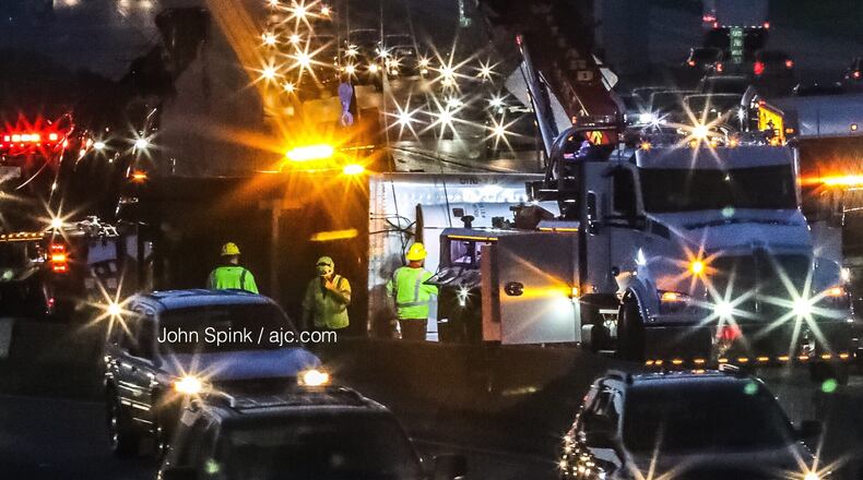 All lanes have reopened on I-285 at Spaghetti Junction after a tractor-trailer overturned early Tuesday morning.