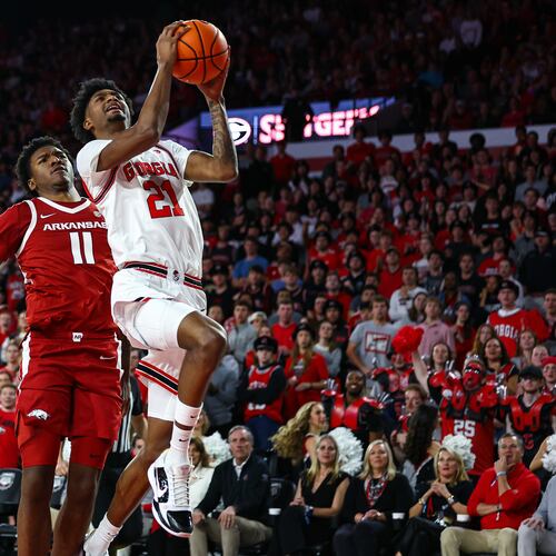 Georgia forward Jake Wilkins (21) shoots against Arkansas forward Karter Knox (11) during the first half of an NCAA college basketball game, Saturday, Jan. 17, 2026, in Athens, Ga. (AP Photo/Colin Hubbard)