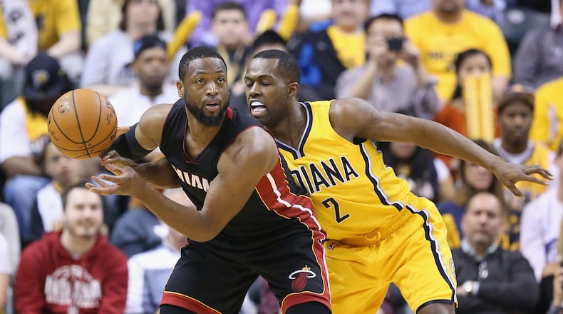 INDIANAPOLIS, IN - APRIL 05: Rodney Stuckey #2 of the Indiana Pacers guards Dwayne Wade #3 of the Miami Heat at Bankers Life Fieldhouse on April 5, 2015 in Indianapolis, Indiana. (Photo by Andy Lyons/Getty Images)