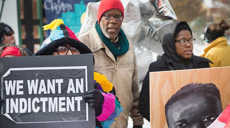 Demonstrators Monday mark the 101st day since 18-year-old Michael Brown was killed by Ferguson police officer Darren Wilson. (Photo by Scott Olson/Getty Images)