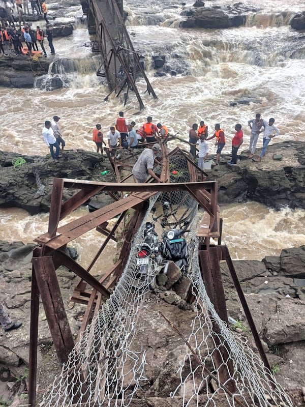 Rescuers work at the site of a bridge collapse near Pune, India, Sunday, June 15, 2025. (AP Photo)