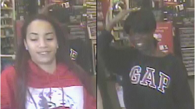 Lawrenceville police are looking for two identity theft suspects who allegedly went on a "shopping spree" at multiple Game Stop locations