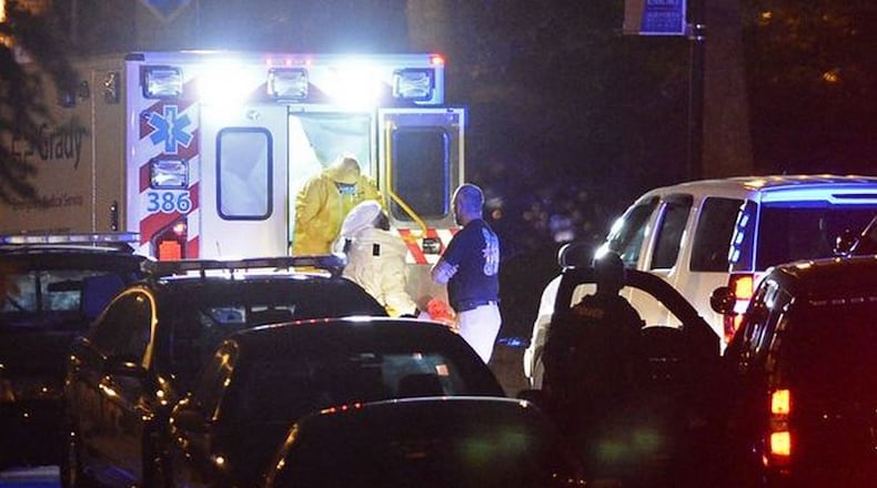 Mystery men in plainclothes accompany Ebola patient from Dallas to Atlanta.