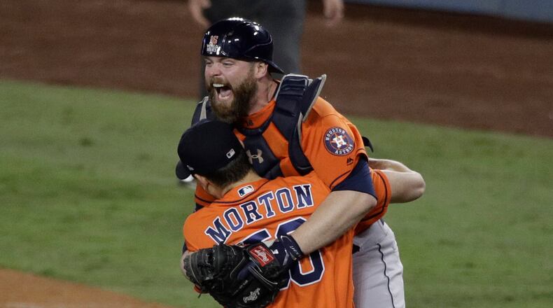 Houston Astros catcher Brian McCann and pitcher Charlie Morton celebrate after win against the Los Angeles Dodgers in Game 7 of baseball's World Series Wednesday, Nov. 1, 2017, in Los Angeles. The Astros won 5-1 to win the series 4-3. (AP Photo/Jae C. Hong)
