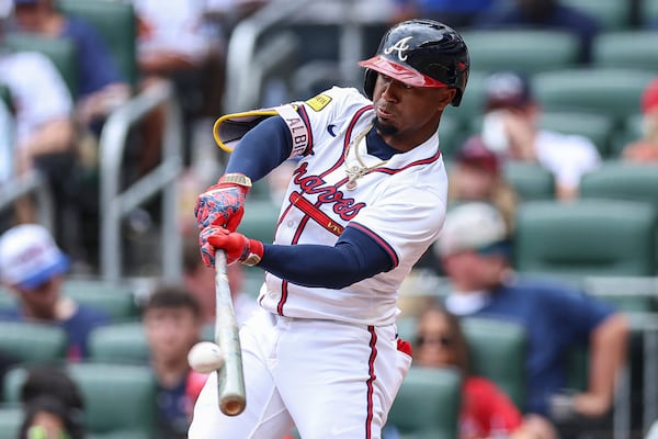 Atlanta Braves' Ozzie Albies hits an RBI double in the second inning of a baseball game against the San Diego Padres, Sunday, May 25, 2025, in Atlanta. (AP Photo/Colin Hubbard)