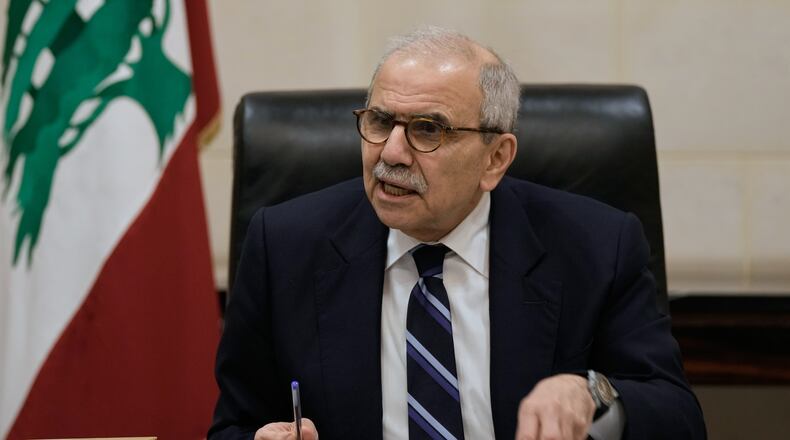 Lebanese Prime Minister Nawaf Salam speaks to journalists working for foreign media and news agencies at the government palace in Beirut, Wednesday, Dec. 3, 2025. (AP Photo/Bilal Hussein)
