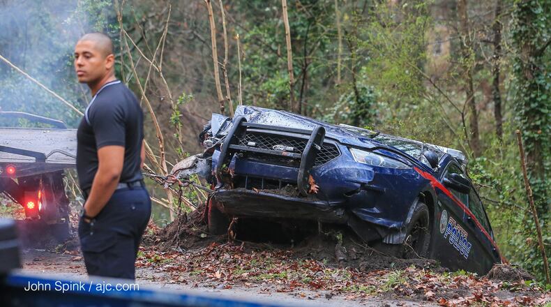 An Atlanta police officer is OK after his patrol car crashed into a power pole on Joseph E. Boone Boulevard. The accident knocked out power to more than 1,000 people early Wednesday.
