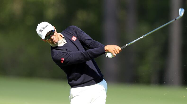Adam Scott, the 2013 champion, hits from the 12th tee on Friday. He shot a round of 69 and is tied for 10th after 36 holes, four shots back of the leaders at Augusta National Golf Club in the 81st Masters. CURTIS COMPTON/ AJC