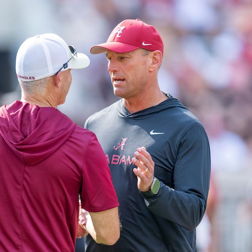 Alabama head coach Kalen DeBoer, right, meets with Florida State head coach Mike Norvell, left, before an NCAA college football game Saturday, Sept. 19, 2026, in Tuscaloosa, Ala. (AP Photo/Vasha Hunt)