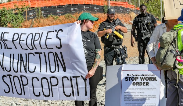 Protesters gathered on Constitution Road after five people were arrested at the site of the Atlanta Public Safety Training Center on Sept. 7, 2023. (John Spink/AJC file photo)