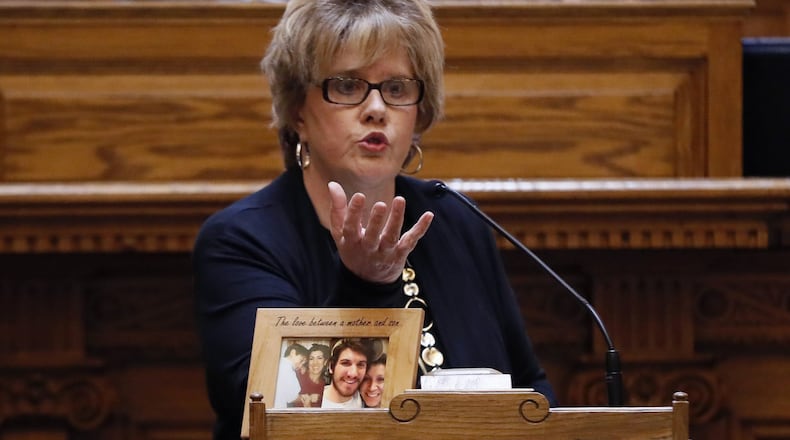 Sen. Renee Unterman, R-Buford, has sponsored several bills to address the opioid crisis in Georgia. On the lectern in front of her is a photo of an unidentified opiod victim. BOB ANDRES /BANDRES@AJC.COM