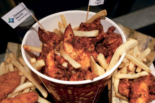 Chicken tenders and fries are among menu offerings from Coop’s Wings at Outfield Market. (Natrice Miller/AJC)