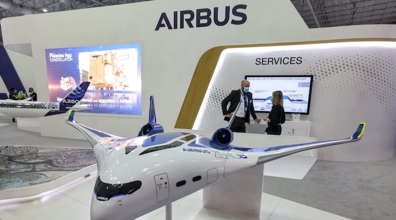This picture taken on November 14, 2021 shows a mockup of one of the blended-wing body concepts of the "Airbus ZEROe" zero-emissions hybrid-hydrogen aircraft, at the booth of a European multinational aerospace corporation Airbus SE, during the 2021 Dubai Airshow in the Gulf emirate. (GIUSEPPE CACACE/AFP via Getty Images/TNS)