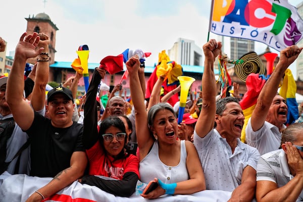 People participate in a rally in support of Colombian President Gustavo Petro's intention to call a referendum on labor reform, in Cali, Colombia, Wednesday, June 11, 2025. (AP Photo/Santiago Saldarriaga)