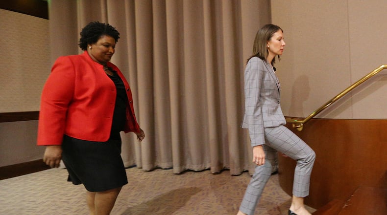 Stacey Abrams (left) and Stacey Evans at the first Democratic forum. Curtis Compton/ccompton@ajc.com