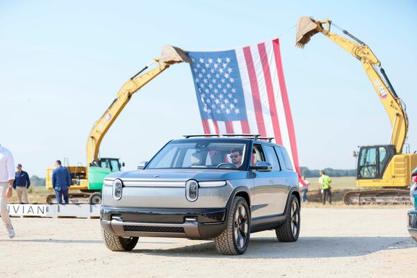 A person drives a Rivian SUV as elected officials, special guests, and Rivian executives gather for the groundbreaking day on Tuesday, Sept. 16, 2025, in Walton and Morgan counties.
(Miguel Martinez/AJC)