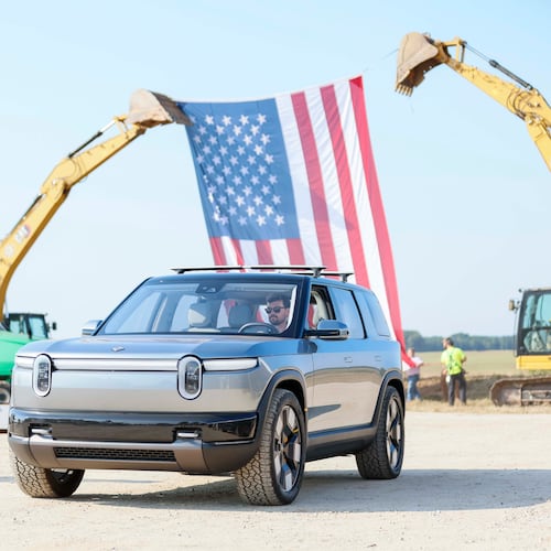 Rivian plans to cut about 4.5% of its workforce, resulting in changes to the company's vehicle servicing, delivery and marketing departments. (Miguel Martinez/AJC)