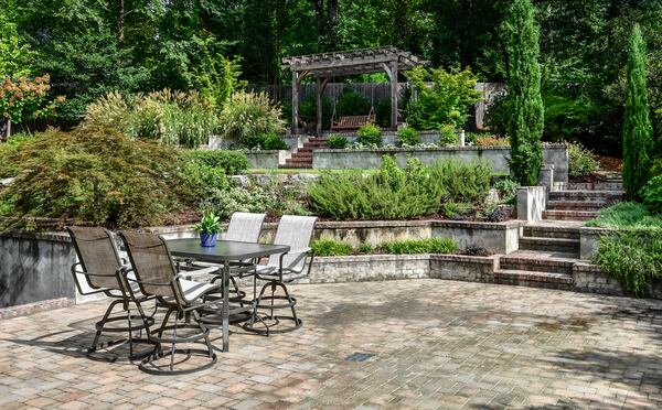 The home also includes a spacious backyard with a covered patio.