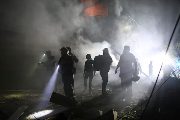 Emergency personnel work at the site of a residential building destroyed by a Russian strike in Zaporizhzhia, Ukraine, on Friday, May 1, 2025. (AP Photo/Kateryna Klochko)