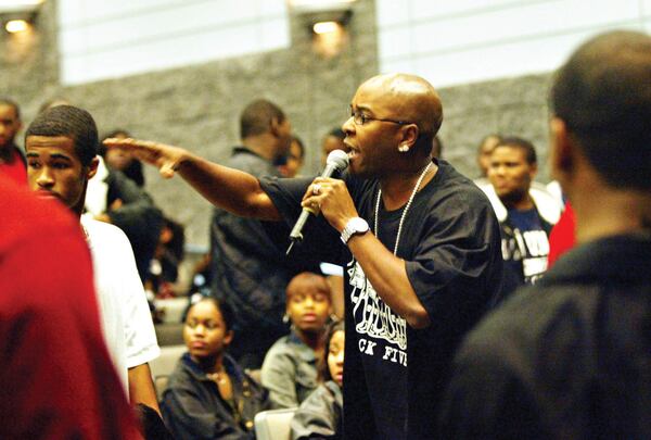  “Every time I do something, every time I say something, I’m representing black fathers, black men,” says Ryan Cameron, who recently spent time with at Westlake High (above and below), signing autographs and urging students to avoid lives of crime. CREDIT: Jenni Girtman